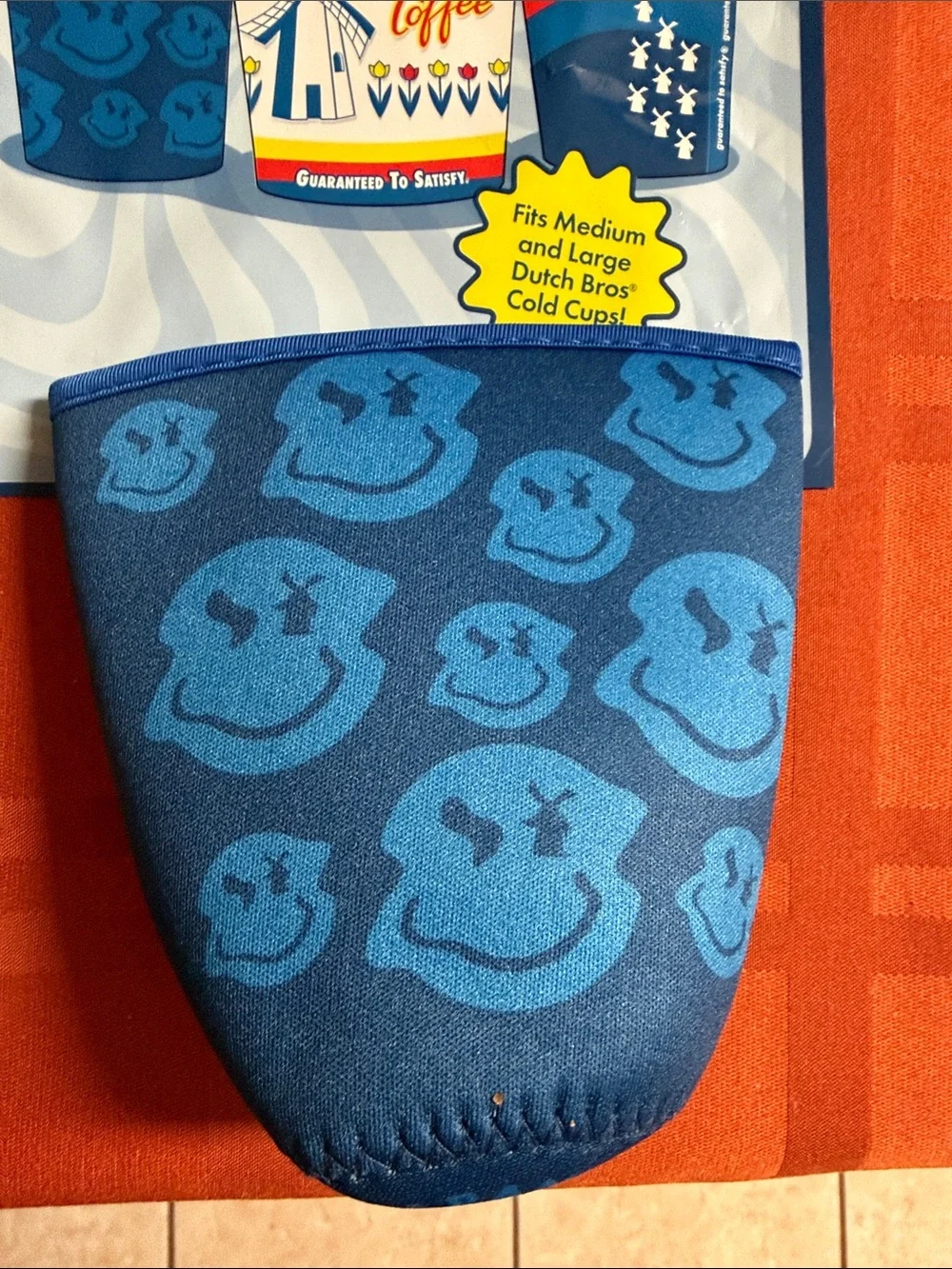 Dutch Bros Blue Mystery Cold Cup Sleeve with Smiley Pattern